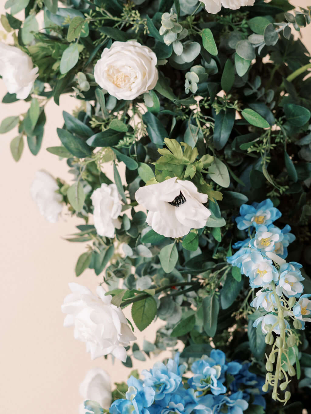 Image of The Aurora Full Collection featuring white and blue floral arrangements with eucalyptus greens.